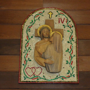This is an example of one of the wood carvings that has been enhanced with the mosaic background.